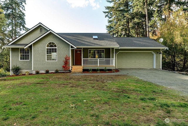 ranch-style house with covered porch, a front lawn, and a garage