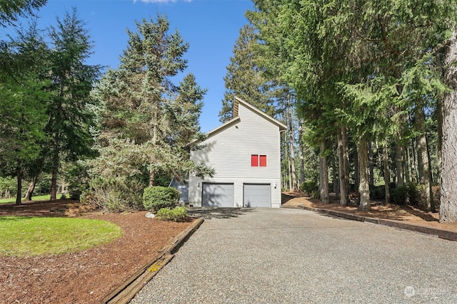 view of side of home with a garage