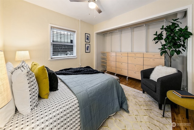 bedroom with wood-type flooring and ceiling fan