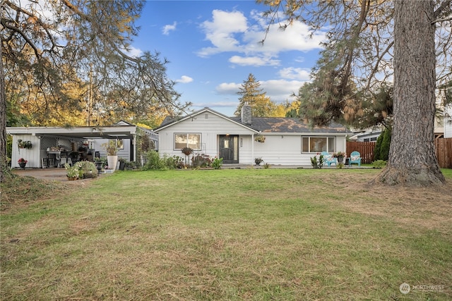 back of house with a yard