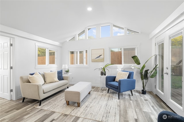 sunroom with french doors, vaulted ceiling, and a healthy amount of sunlight