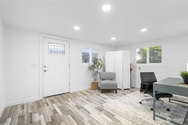 office area with light hardwood / wood-style floors