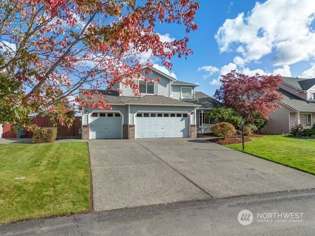 13703 68th Avenue Ct E, Puyallup, WA 98373 - traditional-style house with driveway, brick siding, and a garage