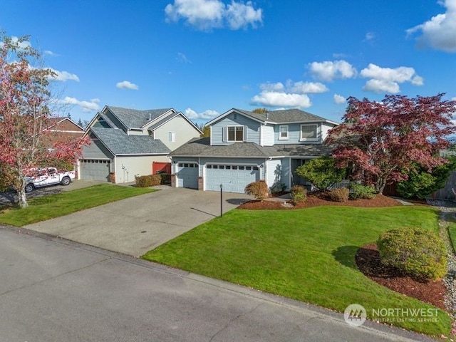 13703 68th Avenue Ct E, Puyallup, WA 98373 - view of front of house with driveway, a front lawn, and an attached garage