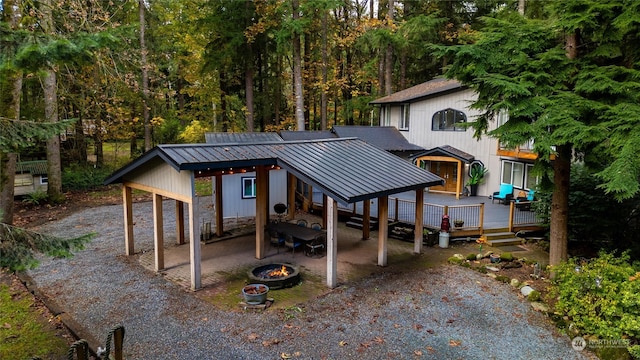 view of front of house featuring a fire pit and a wooden deck