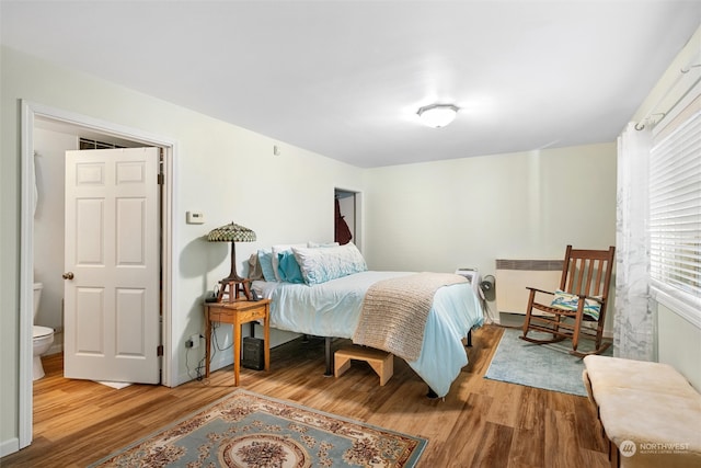 bedroom featuring hardwood / wood-style flooring