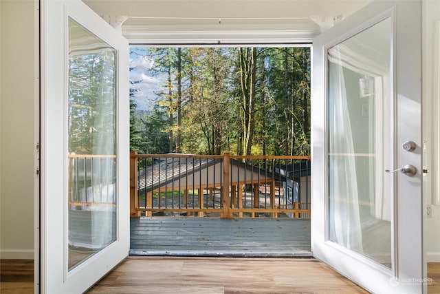 doorway to outside with hardwood / wood-style flooring