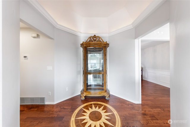 interior details with crown molding and hardwood / wood-style floors