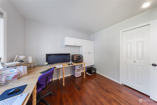 office space with dark wood-type flooring