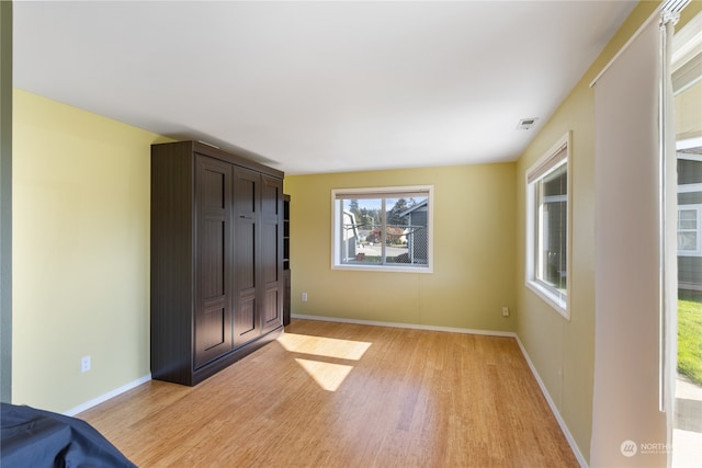 unfurnished bedroom featuring light hardwood / wood-style floors