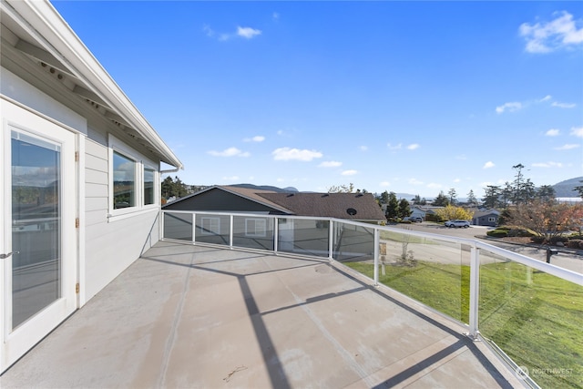 view of patio featuring a balcony