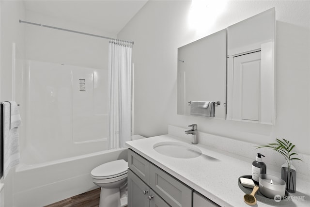 full bathroom with vanity, toilet, shower / bath combo with shower curtain, and hardwood / wood-style floors