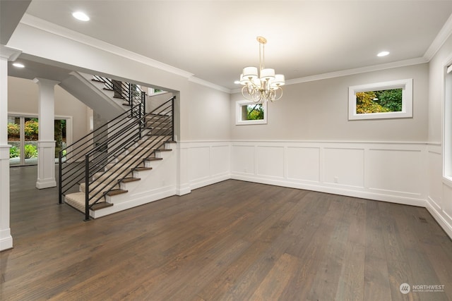 unfurnished dining area with an inviting chandelier, dark hardwood / wood-style floors, plenty of natural light, and crown molding