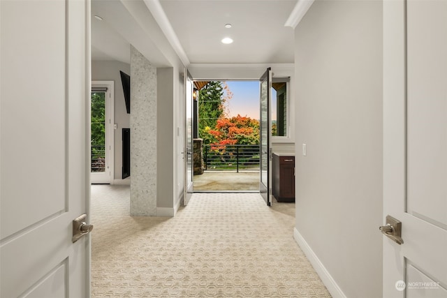 entryway featuring light carpet