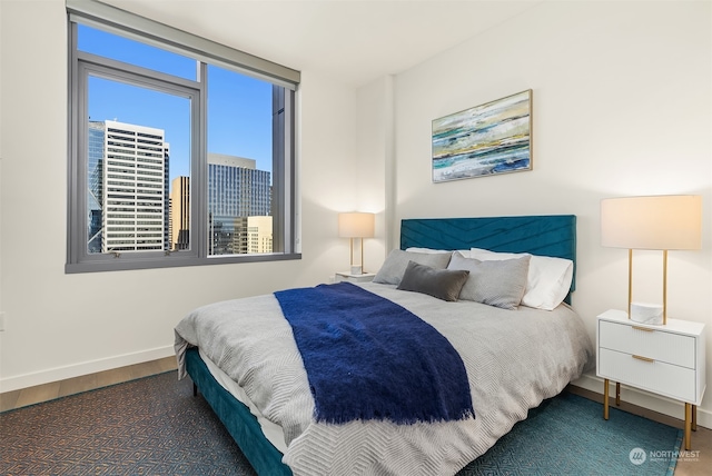 bedroom featuring dark hardwood / wood-style flooring