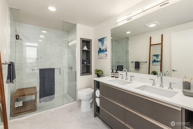 bathroom featuring vanity, toilet, and an enclosed shower