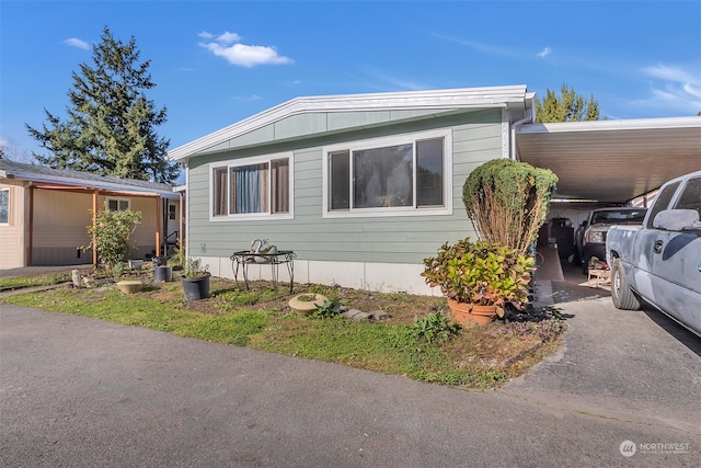 view of side of property featuring a carport