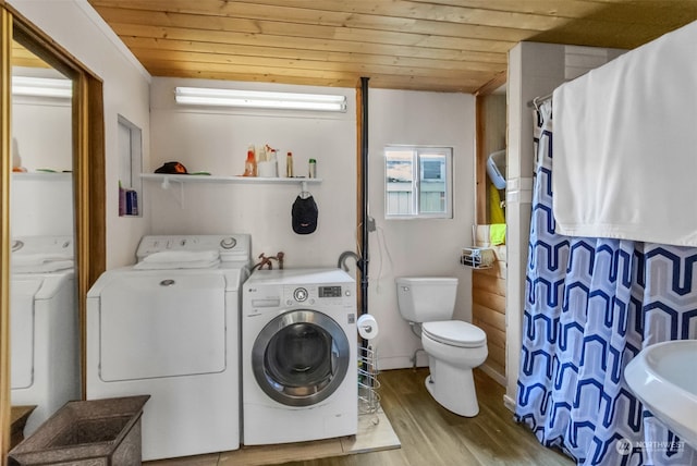 laundry area with washer and clothes dryer, wood ceiling, and light hardwood / wood-style flooring