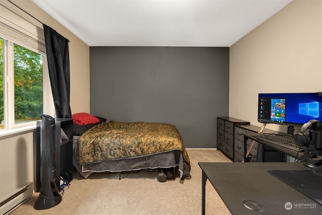 carpeted bedroom featuring a baseboard radiator