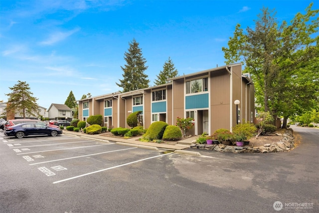 10648 SE 254th Pl Unit I3, Kent, WA 98030 - view of building exterior with uncovered parking