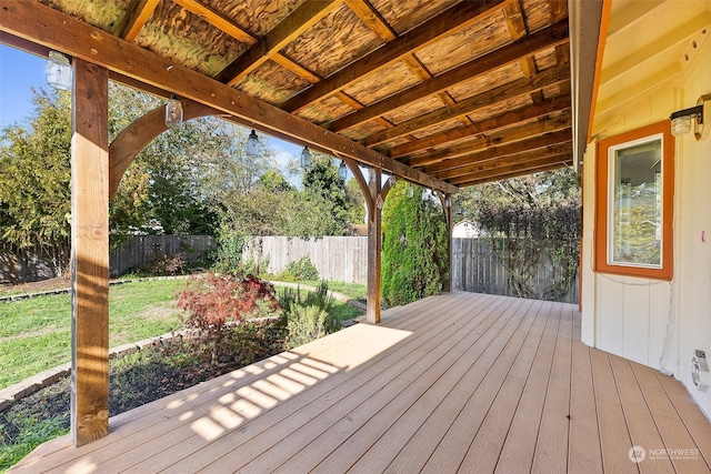 wooden terrace with a lawn