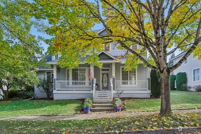 view of front of home with a front lawn and covered porch