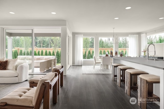 sunroom / solarium featuring sink