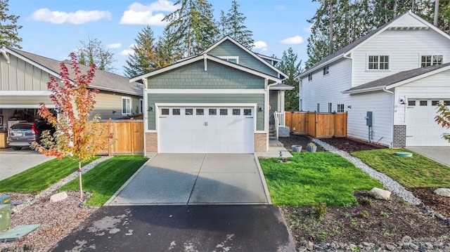 view of front facade featuring a front yard and a garage