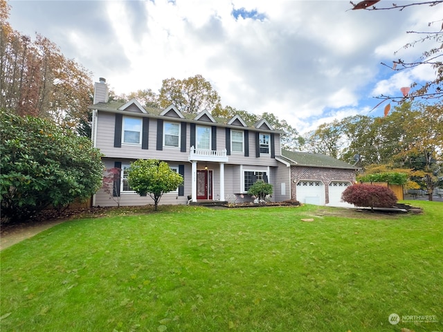 view of front of home featuring a garage and a front yard