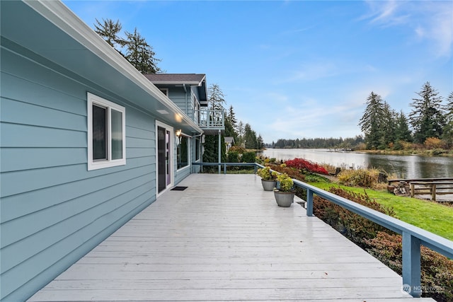 wooden deck featuring a water view