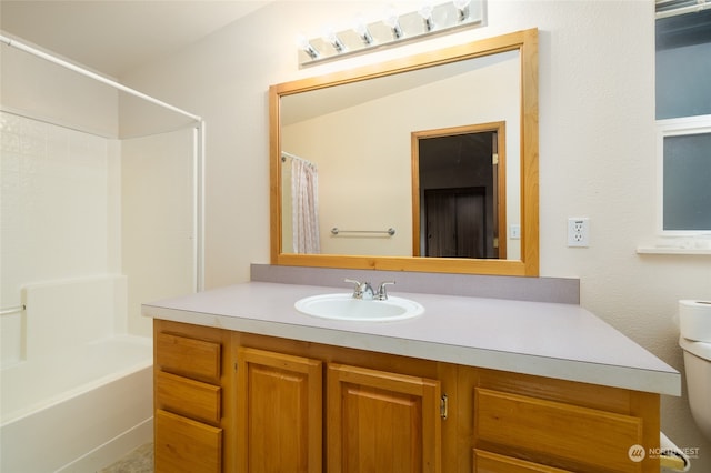 full bathroom with vanity, toilet, and shower / tub combo with curtain