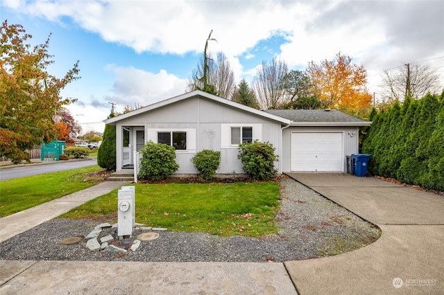 single story home with a garage and a front yard