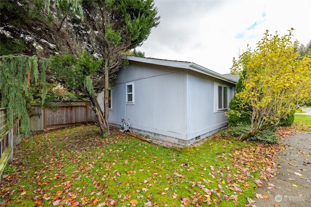 view of home's exterior with a yard