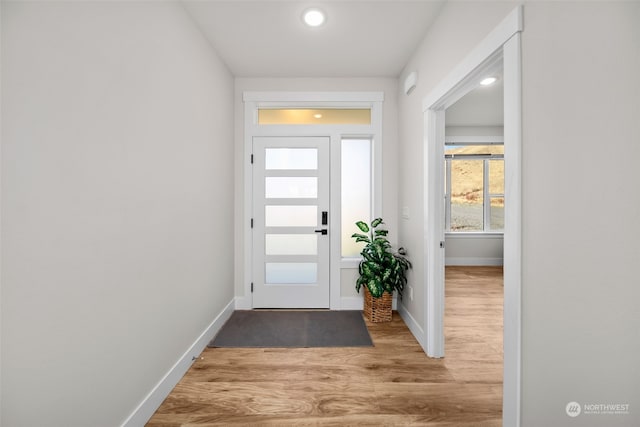 doorway with light hardwood / wood-style floors