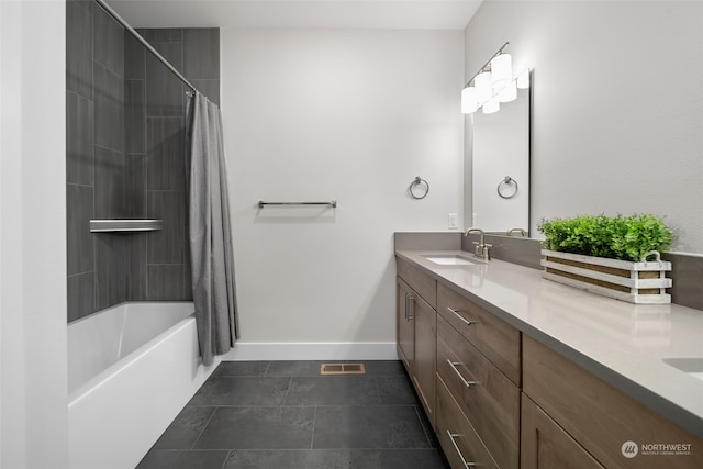 bathroom with vanity, shower / tub combo with curtain, and tile patterned floors