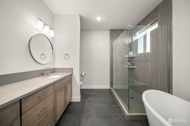 full bathroom with vanity, toilet, tile patterned floors, and plus walk in shower