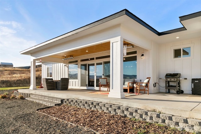 back of property featuring a patio area and ceiling fan