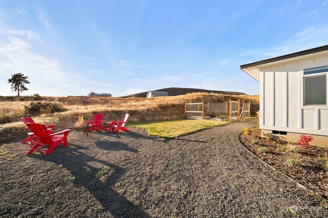 view of yard with a fire pit