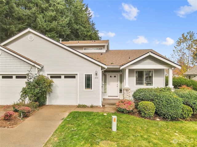 front of property featuring a garage and a front lawn