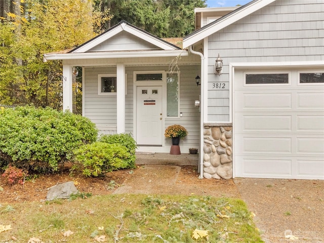 doorway to property featuring a garage