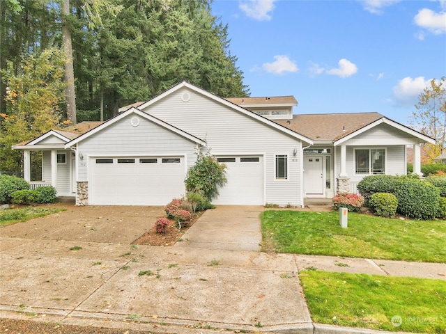 view of front of home featuring a garage and a front yard