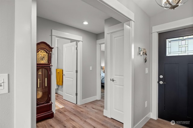 entrance foyer with recessed lighting, baseboards, and light wood-type flooring