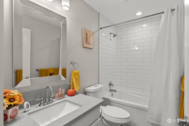 bathroom with vanity, recessed lighting, toilet, and shower / tub combo
