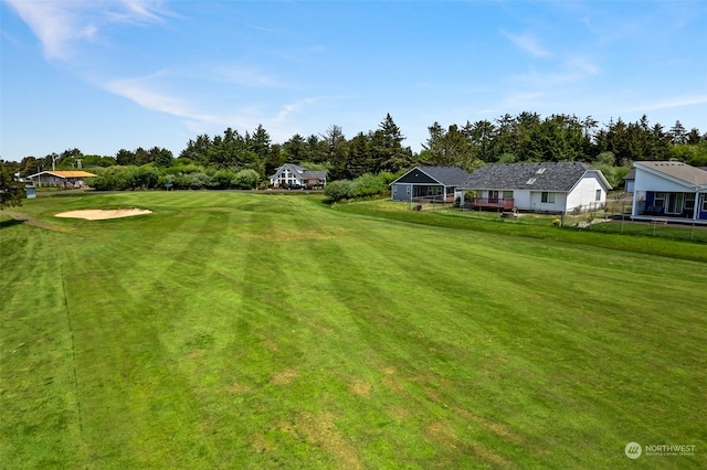 view of yard featuring view of golf course