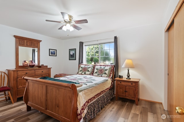 bedroom featuring a closet, ceiling fan, and wood-type flooring