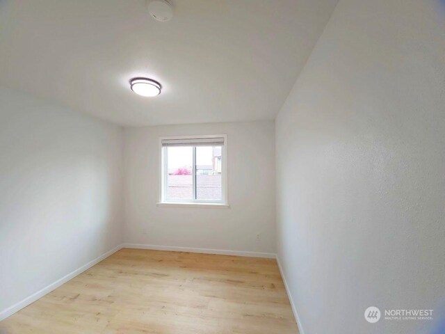 3600 Narrows View Ln Unit 201, Bremerton, WA 98310 - unfurnished room featuring light wood-style flooring and baseboards