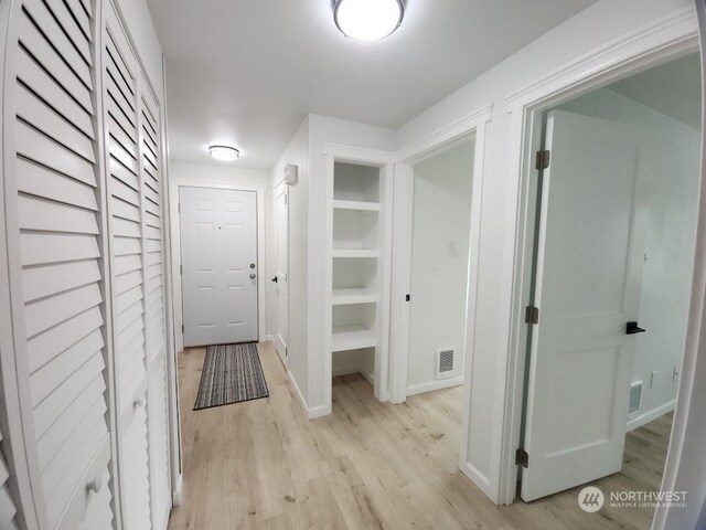 3600 Narrows View Ln Unit 201, Bremerton, WA 98310 - hallway with light wood finished floors and baseboards