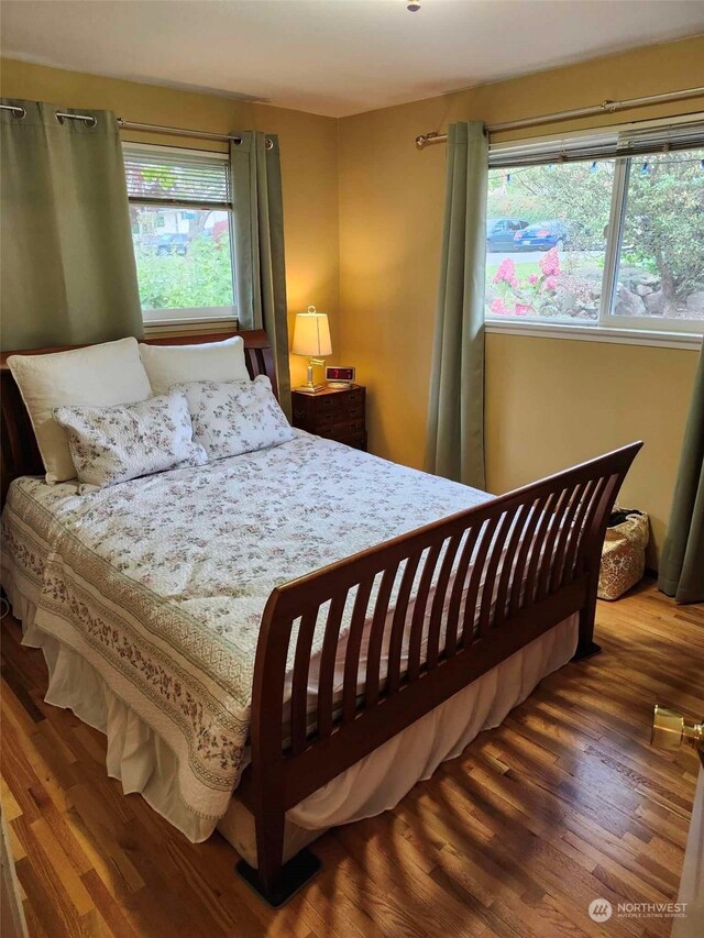 bedroom featuring dark hardwood / wood-style flooring