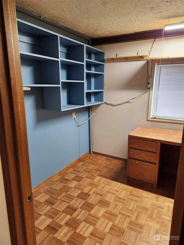 spacious closet featuring light parquet flooring