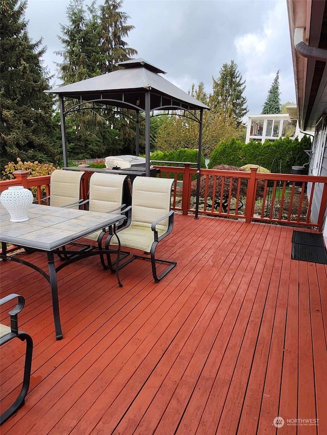 wooden deck featuring a gazebo